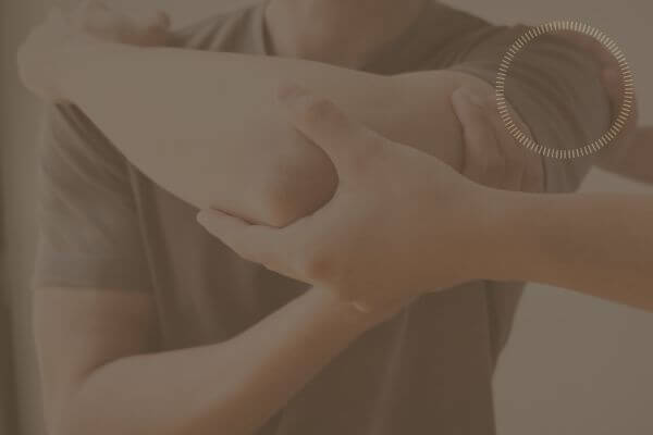 physio holding arm and shoulder of patient